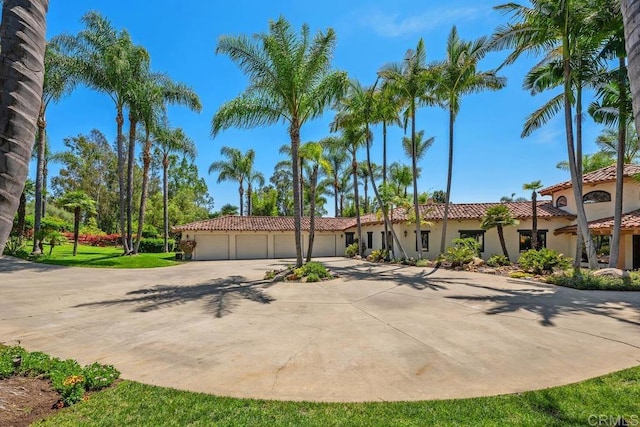 9 Rolling View Ln, Fallbrook, CA 92028 - view of front facade featuring stucco siding, driveway, a tile roof, and an attached garage