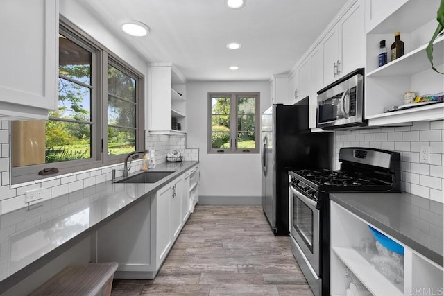 9 Rolling View Ln, Fallbrook, CA 92028 - kitchen with open shelves, stainless steel appliances, healthy amount of natural light, white cabinets, and recessed lighting