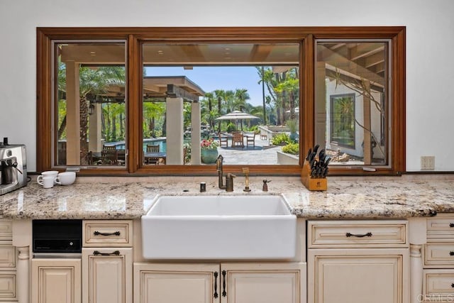 9 Rolling View Ln, Fallbrook, CA 92028 - kitchen with cream cabinetry, light stone counters, and plenty of natural light
