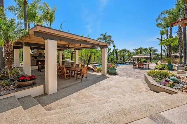 9 Rolling View Ln, Fallbrook, CA 92028 - view of patio / terrace featuring a gazebo, outdoor dining space, an outdoor pool, and an outdoor stone fireplace