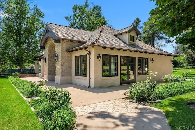 9 Rolling View Ln, Fallbrook, CA 92028 - rear view of property with stucco siding, a patio, a high end roof, stone siding, and a yard