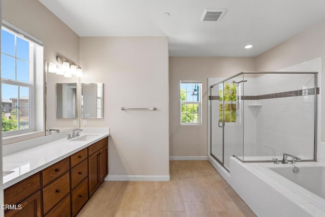 1655 Range Rd, Oxnard, CA 93036 - bathroom with double vanity, plenty of natural light, a stall shower, a bath, and recessed lighting