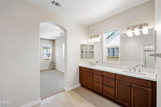 1655 Range Rd, Oxnard, CA 93036 - full bathroom with double vanity and baseboards