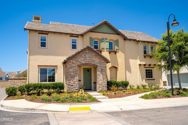 1655 Range Rd, Oxnard, CA 93036 - view of front of property featuring a tile roof, stucco siding, and stone siding