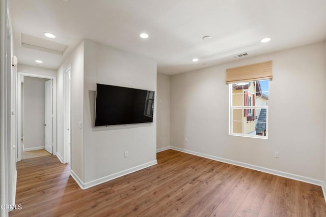 1655 Range Rd, Oxnard, CA 93036 - unfurnished living room with attic access, wood finished floors, and recessed lighting