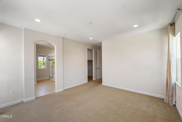 1655 Range Rd, Oxnard, CA 93036 - empty room with arched walkways, light carpet, and recessed lighting