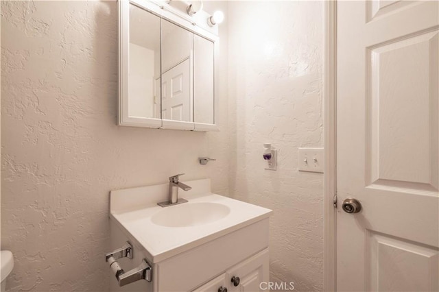 1044 E Country Club Blvd, Big Bear City, CA 92314 - bathroom featuring a textured wall and vanity