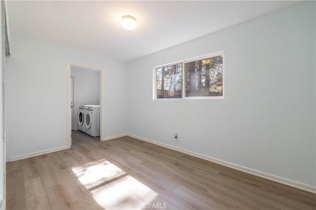 1044 E Country Club Blvd, Big Bear City, CA 92314 - spare room with separate washer and dryer and wood finished floors