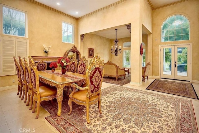 162 Dusty Rose Ct, Simi Valley, CA 93065 - tiled dining space with a chandelier, french doors, ornamental molding, and a towering ceiling