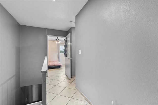 1571 S Reservoir St Unit C, Pomona, CA 91766 - hall with light tile patterned floors and baseboards