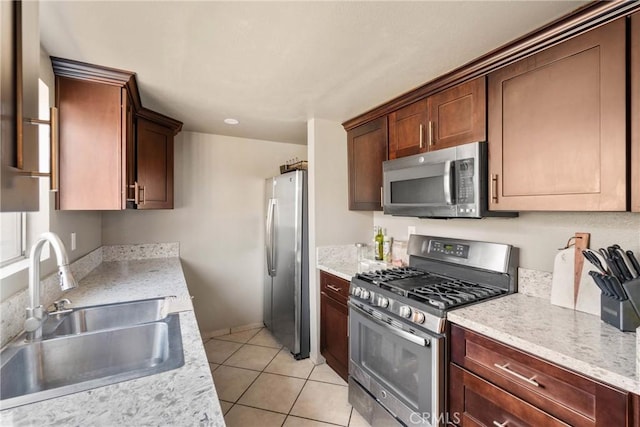 1571 S Reservoir St Unit C, Pomona, CA 91766 - kitchen featuring stainless steel appliances, light countertops, and light tile patterned floors