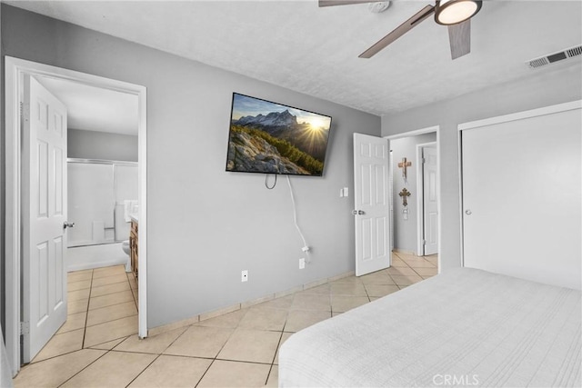 1571 S Reservoir St Unit C, Pomona, CA 91766 - bedroom featuring light tile patterned floors, connected bathroom, and a ceiling fan
