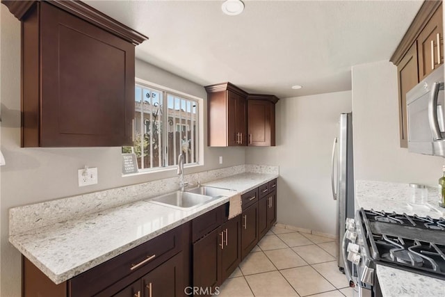 1571 S Reservoir St Unit C, Pomona, CA 91766 - kitchen featuring stainless steel appliances, dark brown cabinets, and light tile patterned floors