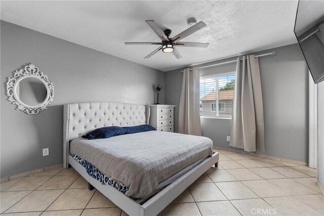 1571 S Reservoir St Unit C, Pomona, CA 91766 - bedroom with light tile patterned floors and a ceiling fan