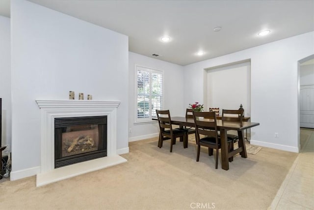6195 Via Huerto Ct, Atascadero, CA 93422 - carpeted dining room featuring a glass covered fireplace and recessed lighting