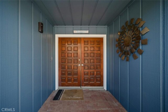 1565 Strand Way, Oceano, CA 93445 - doorway to property featuring board and batten siding