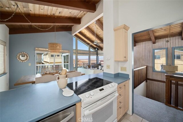 1565 Strand Way, Oceano, CA 93445 - kitchen with electric range, wooden ceiling, wood walls, light tile patterned flooring, and dishwasher