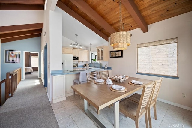 1565 Strand Way, Oceano, CA 93445 - dining area featuring a chandelier, a wooden ceiling with exposed beams, light tile patterned floors, and high vaulted ceiling