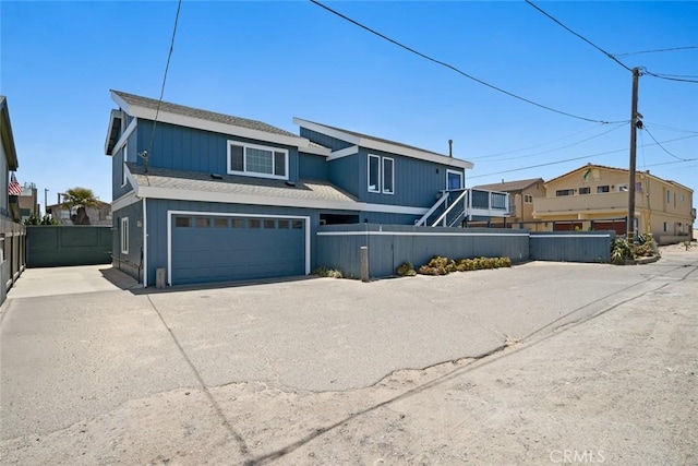 1565 Strand Way, Oceano, CA 93445 - view of front of home with a garage, driveway, and roof with shingles