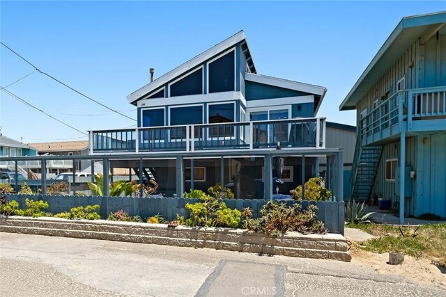 1565 Strand Way, Oceano, CA 93445 - view of front of home with stairway and a wooden deck