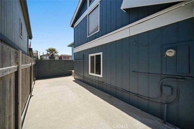 1565 Strand Way, Oceano, CA 93445 - view of side of home with board and batten siding and a patio