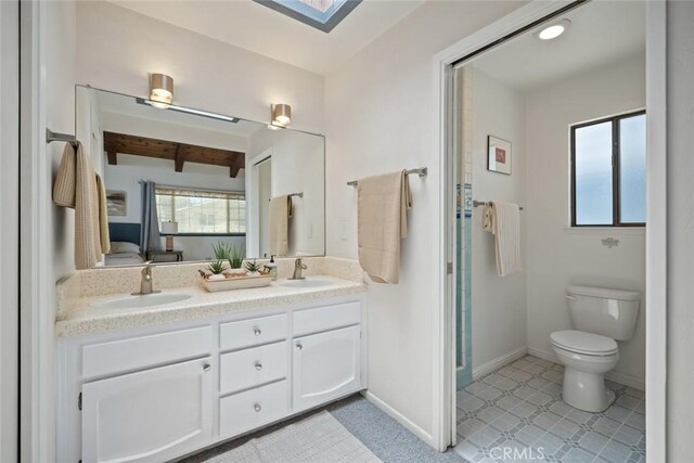 1565 Strand Way, Oceano, CA 93445 - bathroom with healthy amount of natural light, double vanity, and a skylight