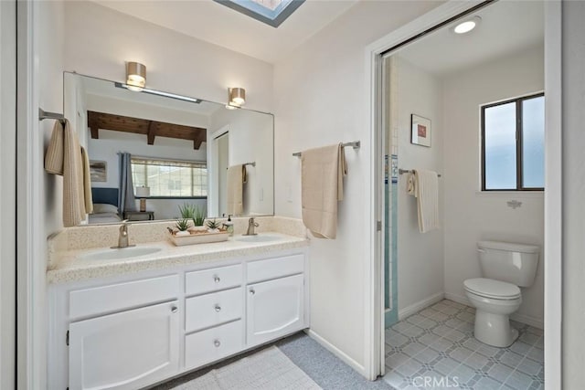 1565 Strand Way, Oceano, CA 93445 - full bathroom featuring healthy amount of natural light, double vanity, beam ceiling, a skylight, and tile patterned floors
