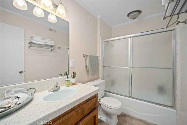 1565 Strand Way, Oceano, CA 93445 - full bathroom with vanity, crown molding, enclosed tub / shower combo, and wood finished floors