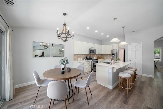 2636 Vineyard Cir, Paso Robles, CA 93446 - dining space featuring a chandelier, wood finished floors, and recessed lighting