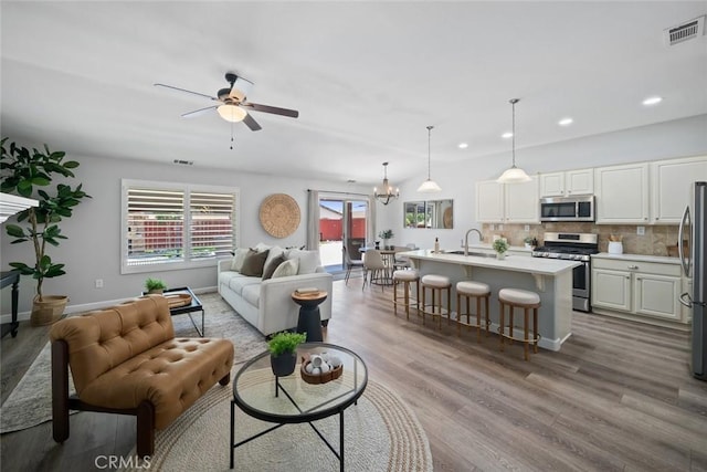 2636 Vineyard Cir, Paso Robles, CA 93446 - living room featuring ceiling fan, wood finished floors, plenty of natural light, and recessed lighting