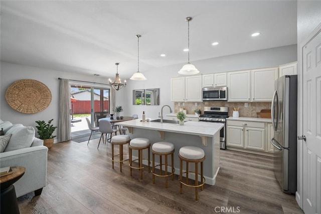 2636 Vineyard Cir, Paso Robles, CA 93446 - kitchen featuring stainless steel appliances, dark wood-style flooring, white cabinetry, tasteful backsplash, and recessed lighting