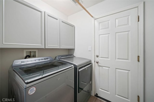 2636 Vineyard Cir, Paso Robles, CA 93446 - washroom with cabinet space, independent washer and dryer, and dark wood-style flooring