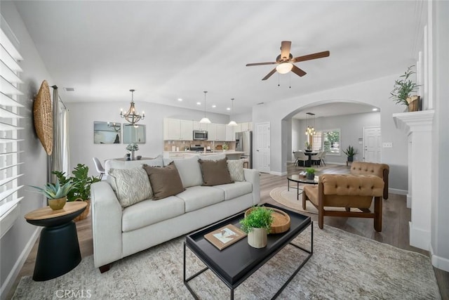 2636 Vineyard Cir, Paso Robles, CA 93446 - living area with a chandelier, arched walkways, light wood-style flooring, ceiling fan, and recessed lighting