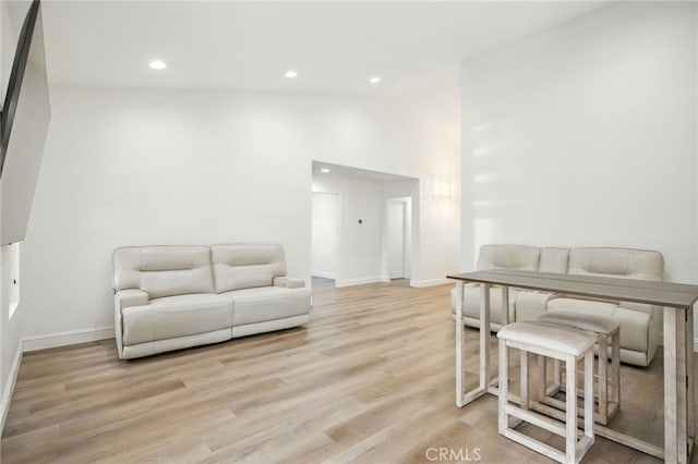 477 S Maidstone St, Banning, CA 92220 - living area featuring light wood-style floors, recessed lighting, and lofted ceiling