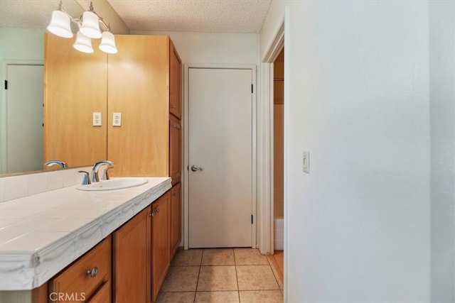 2829 Irving St, Riverside, CA 92504 - bathroom featuring vanity, a textured ceiling, and tile patterned floors