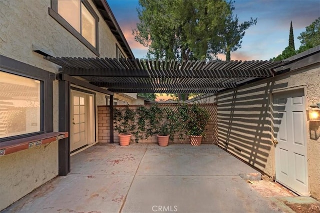 2829 Irving St, Riverside, CA 92504 - patio terrace at dusk featuring a pergola and a patio