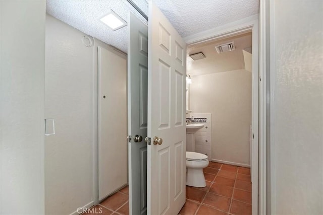 2829 Irving St, Riverside, CA 92504 - bathroom with tile patterned floors and a textured ceiling