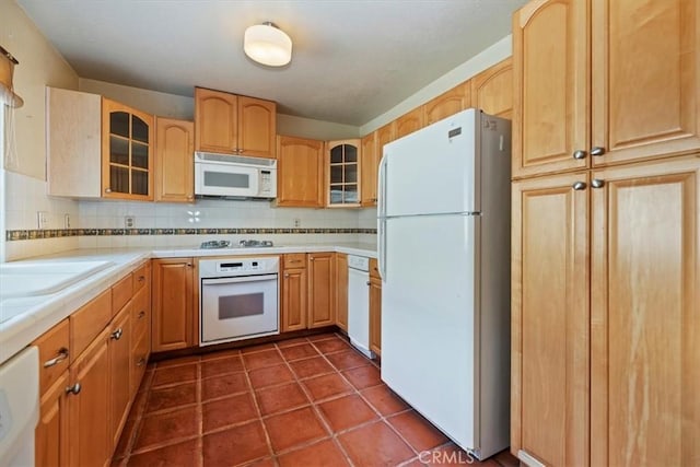 2829 Irving St, Riverside, CA 92504 - kitchen with white appliances, tasteful backsplash, glass insert cabinets, and tile countertops
