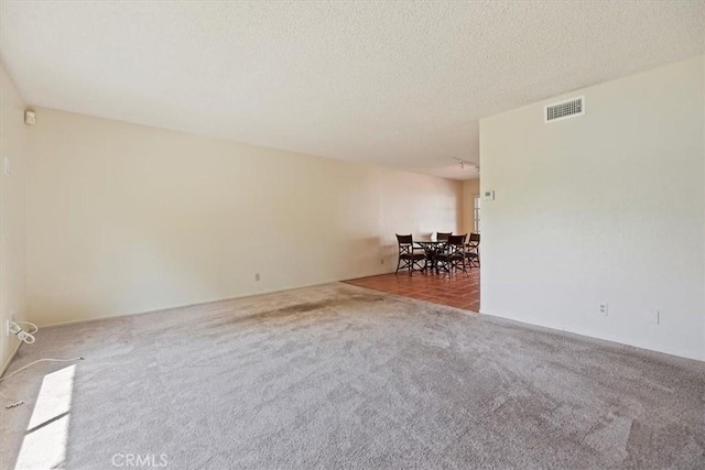 2829 Irving St, Riverside, CA 92504 - carpeted empty room with a textured ceiling
