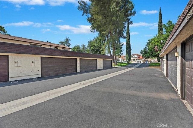 2829 Irving St, Riverside, CA 92504 - view of asphalt road featuring community garages and a residential view
