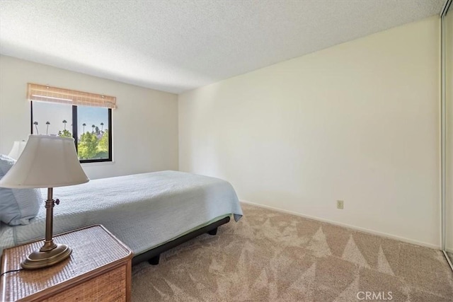 2829 Irving St, Riverside, CA 92504 - carpeted bedroom with a textured ceiling and baseboards