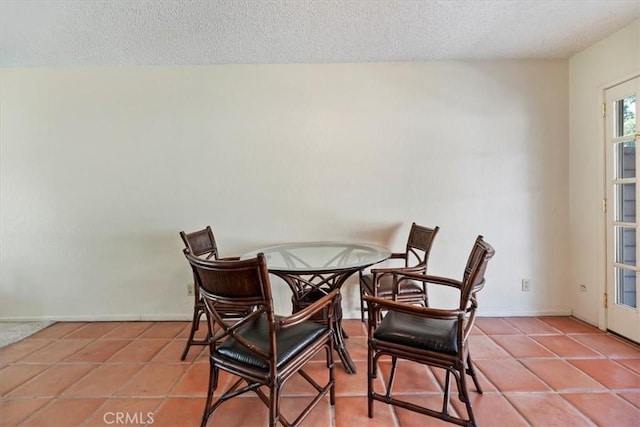 2829 Irving St, Riverside, CA 92504 - dining space featuring a textured ceiling and tile patterned floors