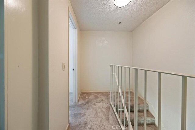 2829 Irving St, Riverside, CA 92504 - hall featuring carpet floors and a textured ceiling