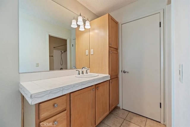 2829 Irving St, Riverside, CA 92504 - bathroom featuring vanity, tile patterned floors, and a textured ceiling