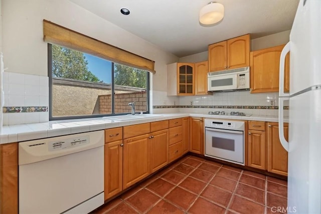 2829 Irving St, Riverside, CA 92504 - kitchen with white appliances, decorative backsplash, glass insert cabinets, and tile countertops