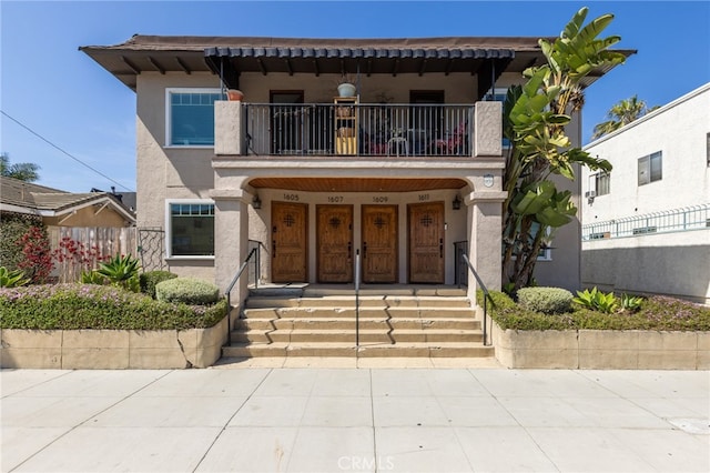 1605 E Broadway, Long Beach, CA 90802 - view of front of home with a balcony, stucco siding, and covered porch
