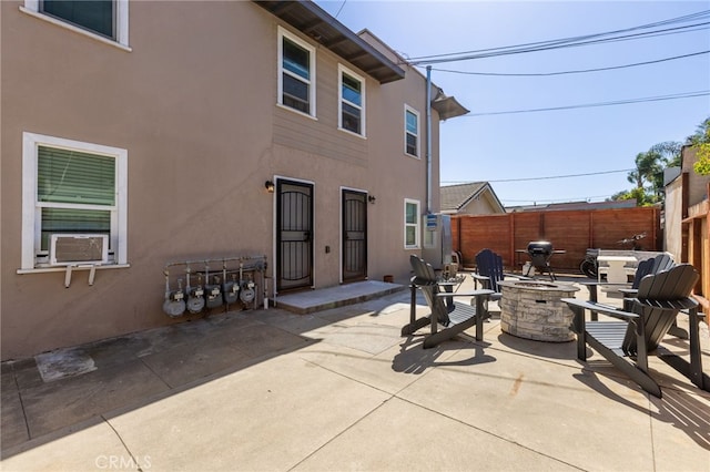 1605 E Broadway, Long Beach, CA 90802 - rear view of property with a fire pit, a patio, and stucco siding