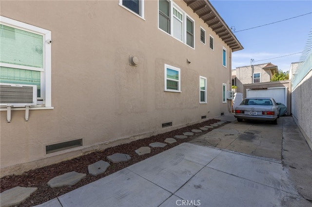 1605 E Broadway, Long Beach, CA 90802 - view of side of home featuring crawl space, cooling unit, and stucco siding