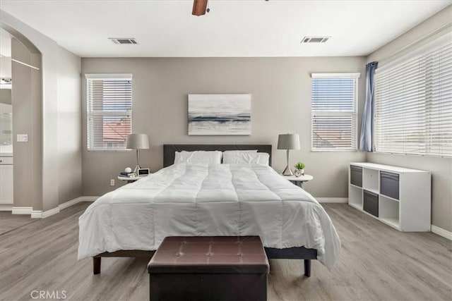 420 Deodar St, Redlands, CA 92374 - bedroom with wood finished floors, multiple windows, and ceiling fan