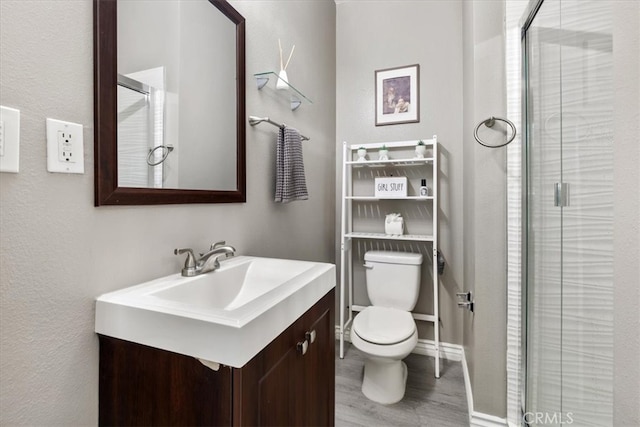420 Deodar St, Redlands, CA 92374 - bathroom with vanity, a shower stall, and wood finished floors